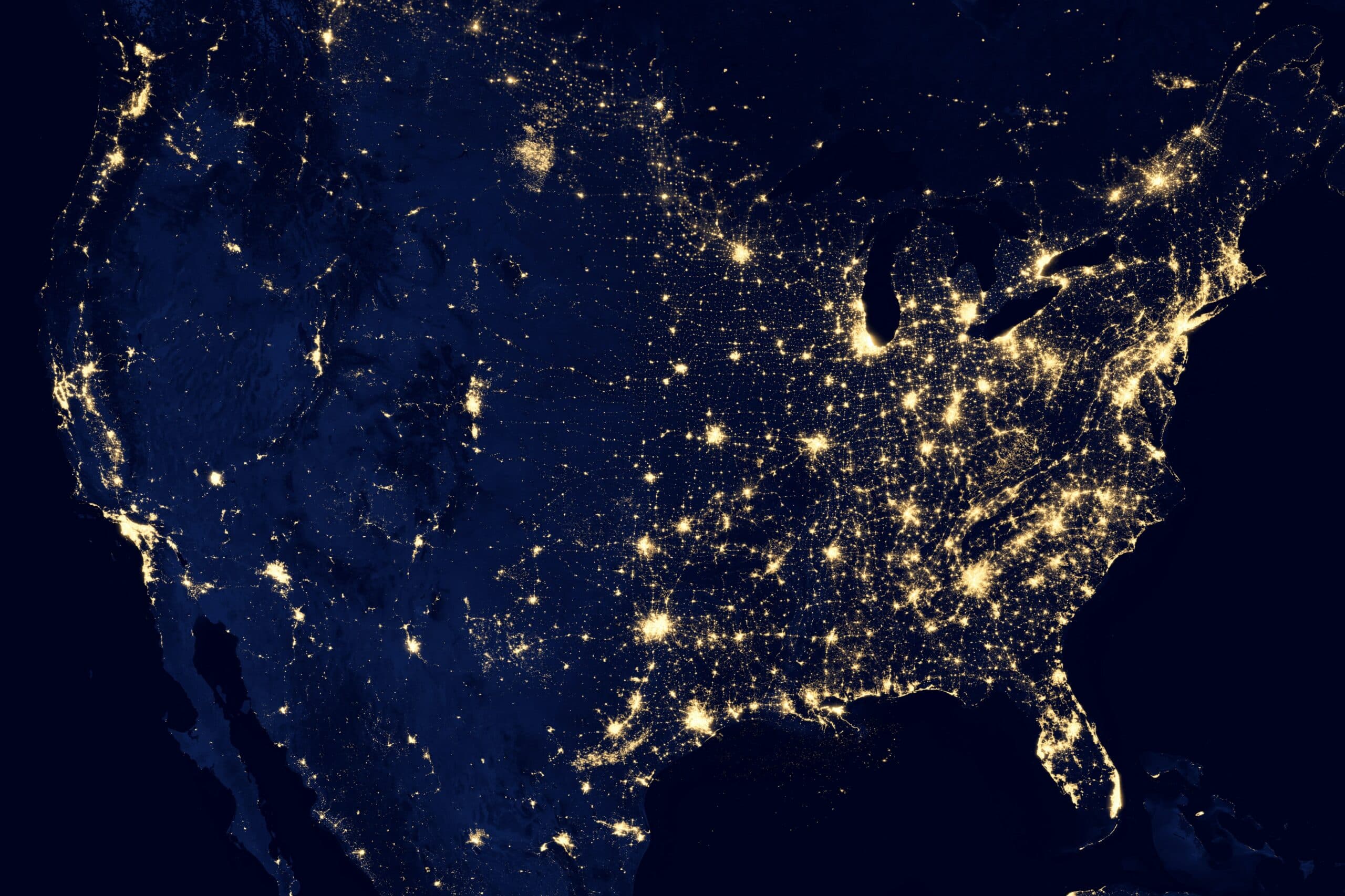 An image of interconnected lights from space indicating networking